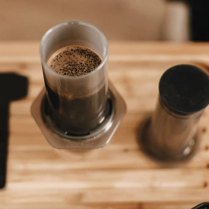 Bits of an Aeropress and a waiting shot of coffee!